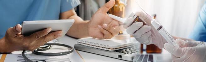 Medicine doctor hand working on a patients x-ray scans digital healthcare and connection with modern virtual screen interface icons, Medical technology and network concept. photo