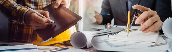 Business and lawyers discussing contract papers with brass scale on desk in office. Law, legal services, advice, justice and law concept picture with film grain effect photo