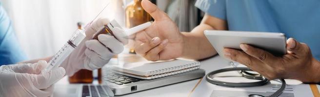 Medicine doctor hand working on a patients x-ray scans digital healthcare and connection with modern virtual screen interface icons, Medical technology and network concept. photo