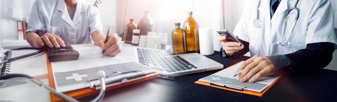 Medicine doctor hand working on a patients x-ray scans digital healthcare and connection with modern virtual screen interface icons, Medical technology and network concept. photo