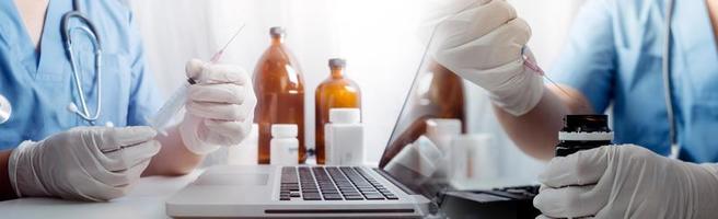 Medicine doctor hand working on a patients x-ray scans digital healthcare and connection with modern virtual screen interface icons, Medical technology and network concept. photo