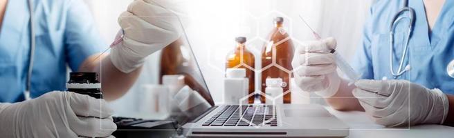 Medicine doctor hand working on a patients x-ray scans digital healthcare and connection with modern virtual screen interface icons, Medical technology and network concept. photo