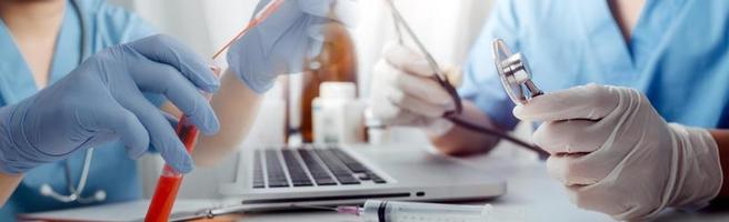 Medicine doctor hand working on a patients x-ray scans digital healthcare and connection with modern virtual screen interface icons, Medical technology and network concept. photo