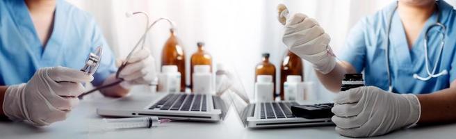 Medicine doctor hand working on a patients x-ray scans digital healthcare and connection with modern virtual screen interface icons, Medical technology and network concept. photo