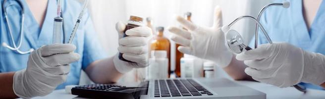Medicine doctor hand working on a patients x-ray scans digital healthcare and connection with modern virtual screen interface icons, Medical technology and network concept. photo