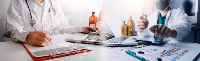 Medicine doctor hand working on a patients x-ray scans digital healthcare and connection with modern virtual screen interface icons, Medical technology and network concept. photo