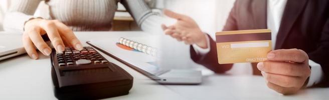 Business and lawyers discussing contract papers with brass scale on desk in office. Law, legal services, advice, justice and law concept picture with film grain effect photo