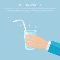 Man hold glass with clean water and straw in hand vector