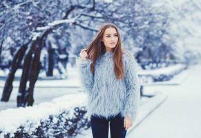 Winter portrait of young beautiful brunette photo