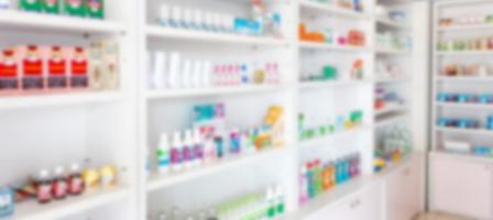 Pharmacy drugstore blur abstract backbround with medicine and healthcare product on shelves photo