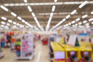 Abstract blur supermarket discount store product shelves interior defocused background photo