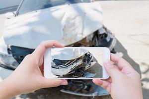 taking photo of the car crash accident damage