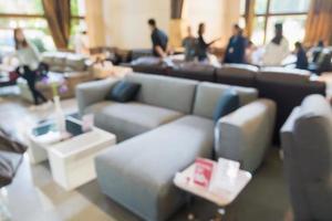 Abstract blur sofa in furniture showroom store interior with bokeh light background for montage product display photo