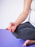 pregnant woman doing yoga at home photo