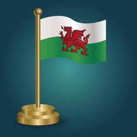 Wales national flag on golden pole on gradation isolated dark background. table flag, vector illustration