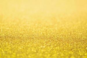 Abstract Gold glitter festive Christmas texture background blur with bokeh light photo