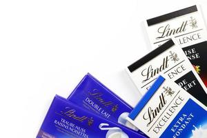 KHARKIV, UKRAINE - DECEMBER 18, 2020 Lindt Chocolate on white background. Lindt and Spruengli AG is a Swiss chocolatier and confectionery company known for their chocolate bars photo