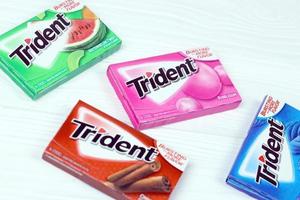 KHARKIV, UKRAINE - MARCH 15, 2021 Packs of Trident gums. Trident was introduced in 1964 as one of the first patented sugarless gums photo