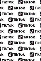 TERNOPIL, UKRAINE - MAY 2, 2022 Many TikTok logo printed on paper. Tiktok or Douyin is a famous Chinese short-form video hosting service owned by ByteDance