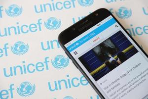 TERNOPIL, UKRAINE - MAY 2, 2022 UNICEF official website on smartphone screen - United Nations programm that provides humanitarian and developmental assistance to children photo