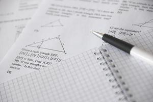 Handwriting of geometrical tasks on examination, practice, quiz or test in geometry class. Solving exponential equations concept. photo