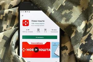 TERNOPIL, UKRAINE - APRIL 24, 2022 Nova Poshta app on Samsung smartphone screen on Play Store, service for delivery your parcels in Ukraine photo