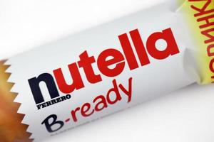 KHARKIV, UKRAINE - DECEMBER 16, 2021 Bar of Nutella B-ready crunchy wafer shell filled with creamy Nutella and sprinkled with puffed crisps photo
