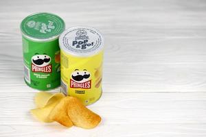 KHARKIV, UKRAINE - DECEMBER 16, 2021 Pringles product with new logo. Pringles is a brand of potato snack chips owned by the Kellogg Company photo