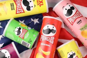 KHARKIV, UKRAINE - DECEMBER 16, 2021 Pringles product with new logo. Pringles is a brand of potato snack chips owned by the Kellogg Company photo