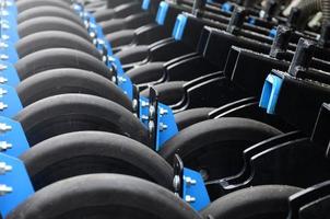 Row of wheels of the new industrial agricultural seeder close up photo