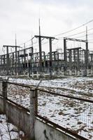 Power plant is a station of transformation. A lot of cables, poles and wires, transformers. Electro-energy. photo