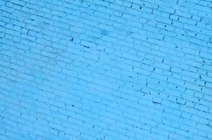 Square brick block wall background and texture. Painted in blue photo