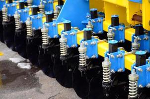 Spring system of agricultural seeder close up photo