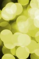 Bokeh effect golden yellow defocused light background. Christmas Lights Concept photo