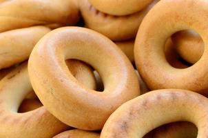 Close-up photo of fresh yellow bagels. A popular kind of flour products. One of the traditional Russian treats for tea