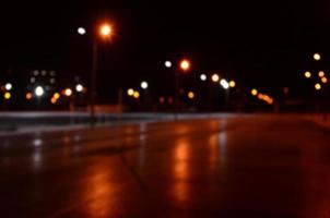 Blurred photo of school playground at night with bright lights