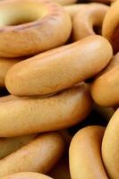 Close-up photo of fresh yellow bagels. A popular kind of flour products. One of the traditional Russian treats for tea