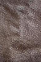 The texture of a very old brown sack cloth. Retro texture with canvas material. Background image with copy space photo