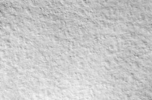 Texture of thick paper intended for watercolor painting. Macro snapshot of details of the relief paper structure photo