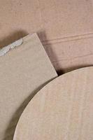 Background image with a lot of beige cardboard paper, which is used to make boxes for the transport of home appliances and postal parcels. Carton texture photo