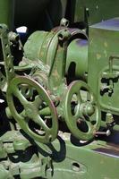 A close-up mechanism of a portable weapon of the Soviet Union of World War II, painted in a dark green color photo