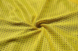 Texture of sportswear made of polyester fiber. Outerwear for sports training has a mesh texture of stretchable nylon fabric photo