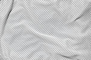 Close up of white polyester nylon sportswear shorts to created a textured background photo