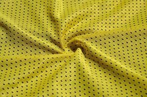 Texture of sportswear made of polyester fiber. Outerwear for sports training has a mesh texture of stretchable nylon fabric photo