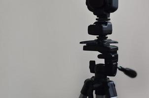 Speedlight gun with trigger set mounted on tripod photo