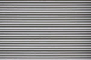 The texture of the shutter door or window in light gray color photo