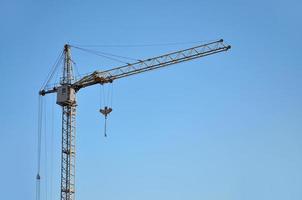 Tower crane against a blue sky photo