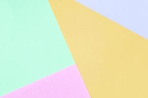 Texture background of fashion pastel colors. Pink, violet, orange and blue geometric pattern papers. photo