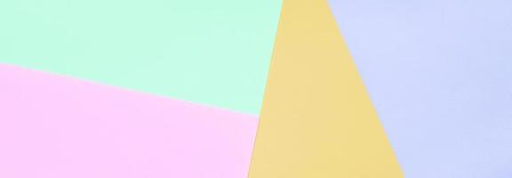 Texture background of fashion pastel colors. Pink, violet, orange and blue geometric pattern papers. photo