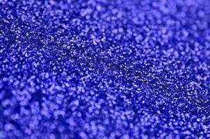 Blue decorative sequins. Background image with shiny bokeh lights from small elements photo